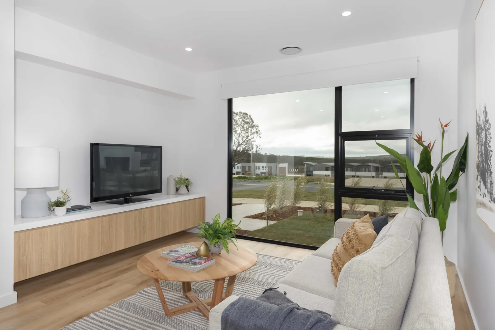 Lounge room with garden outlook and floating timber joinery