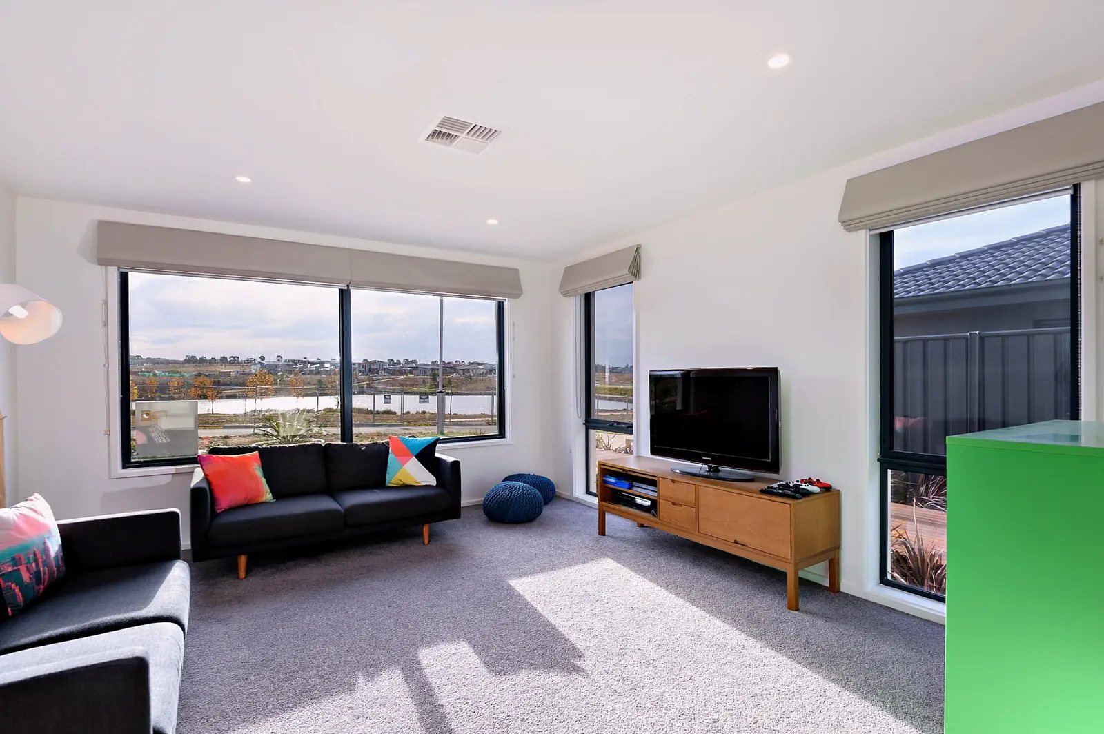 Second living area with large windows and water views