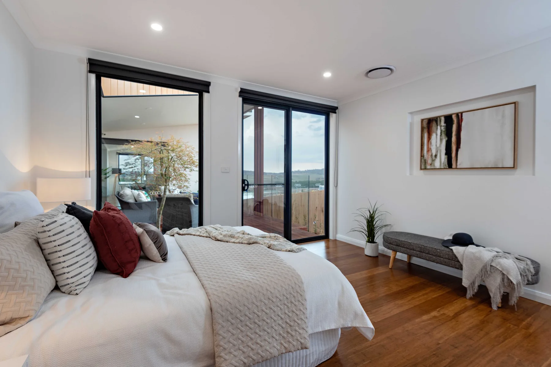 Master bedroom opening to the balcony with rural outlook