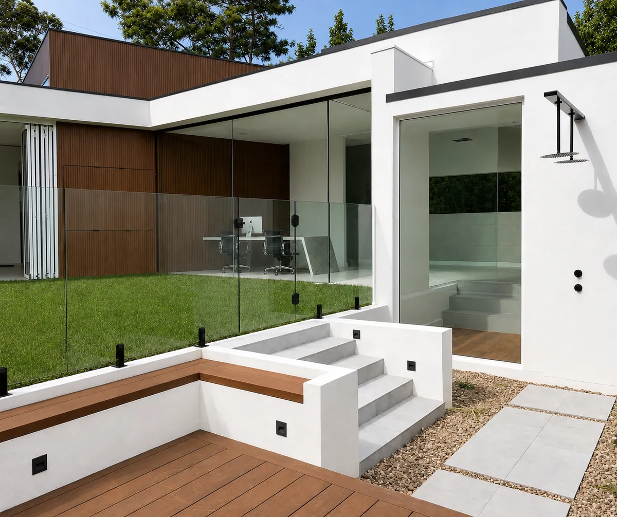Rear exterior with composite decking, rendered steps and full height glazing