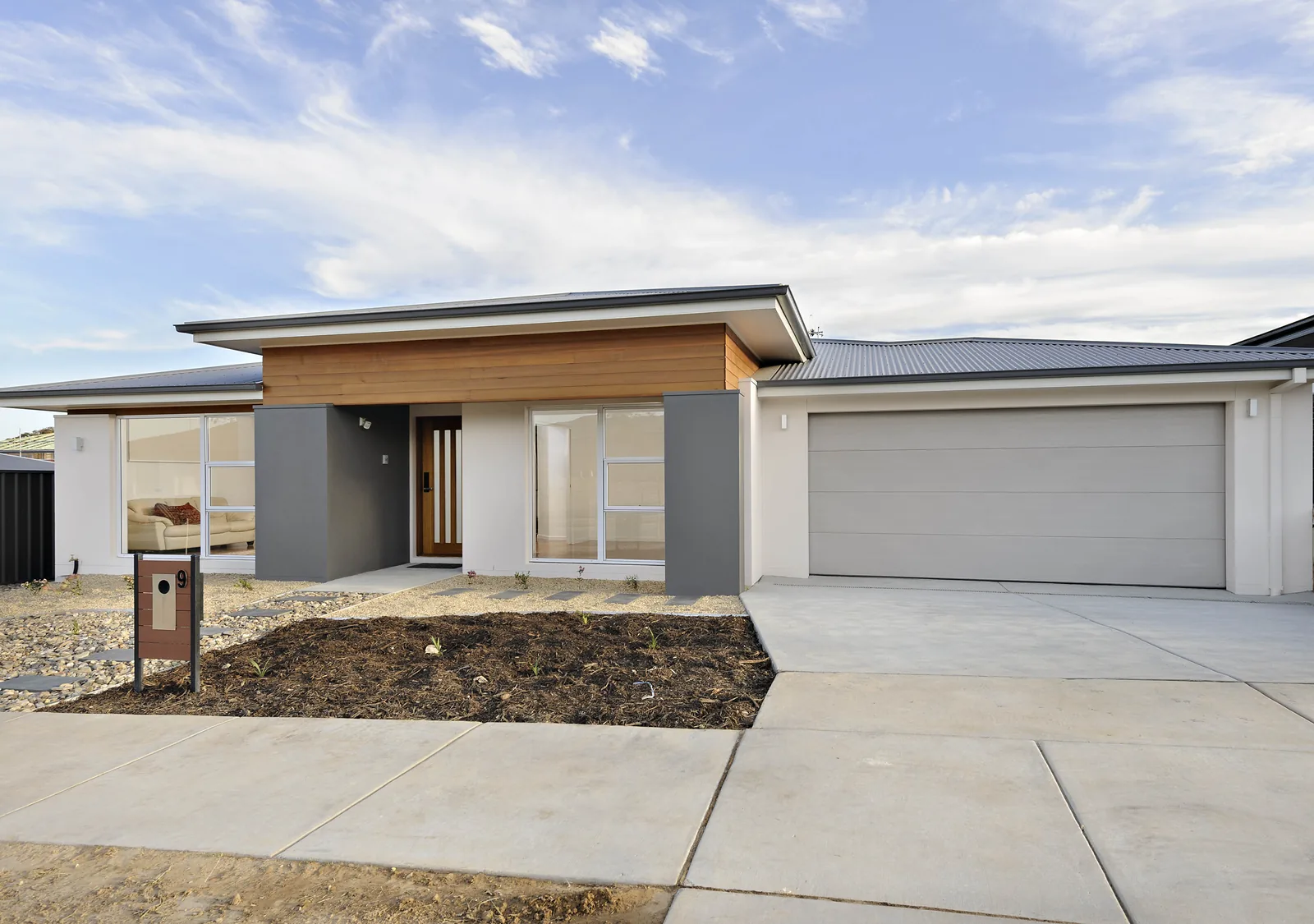 Completed single level home with timber clad entry, Moncrieff ACT