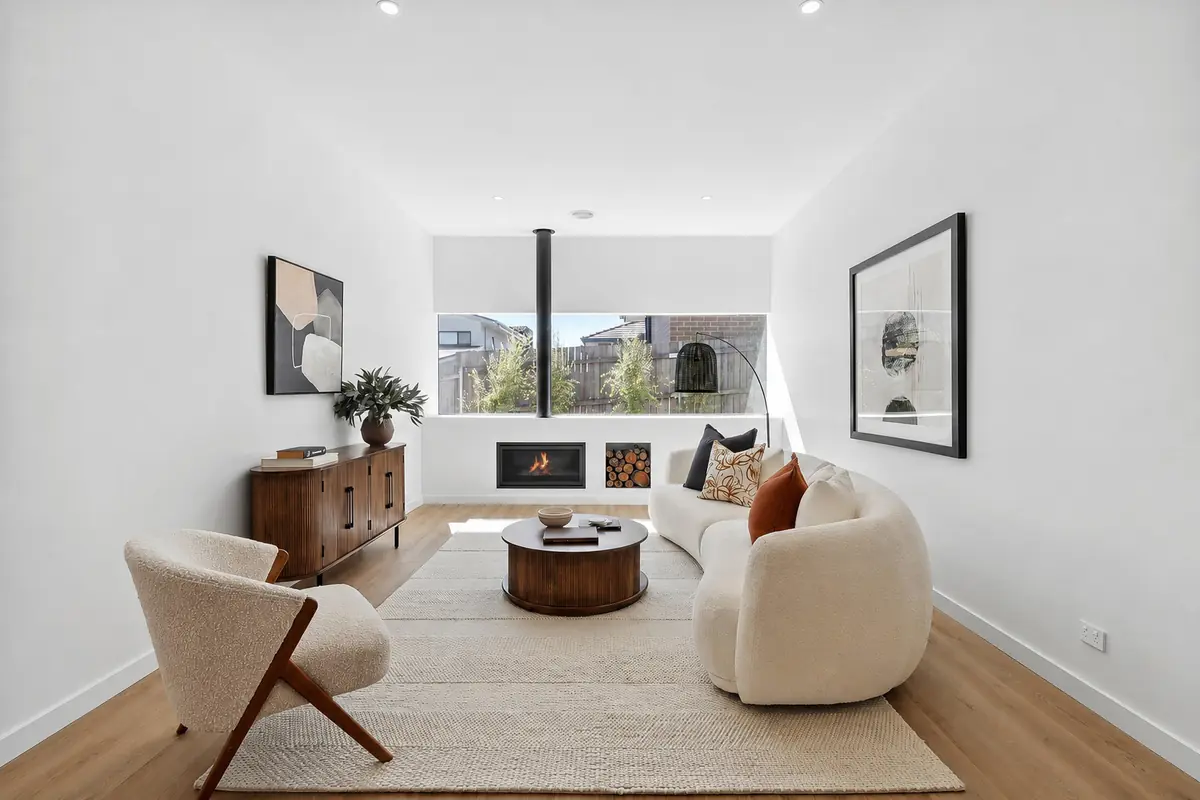 Living room with fireplace and winter light, Boyanton Street Canberra