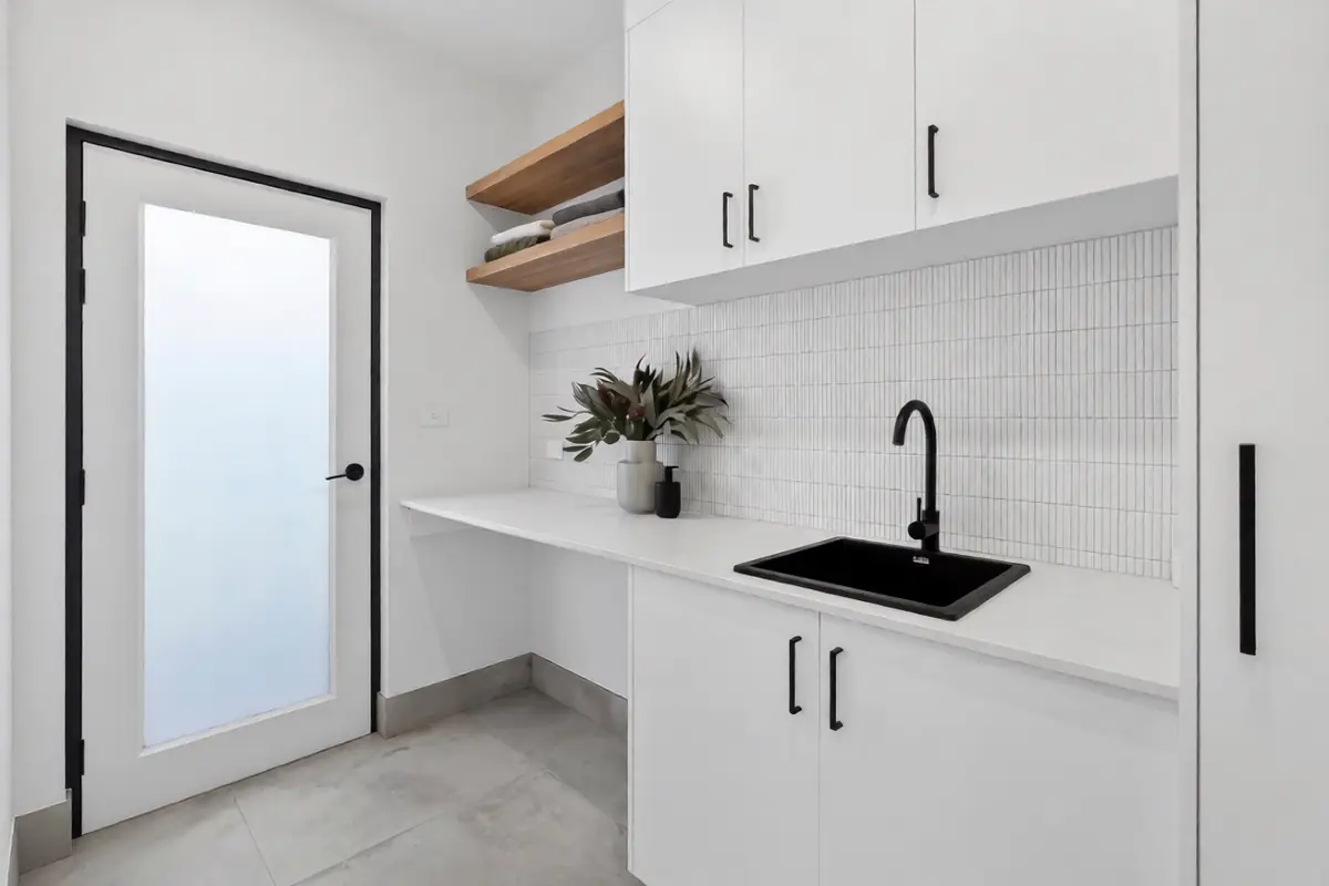 Laundry with stone benchtop and timber shelves, Boyanton Street Canberra