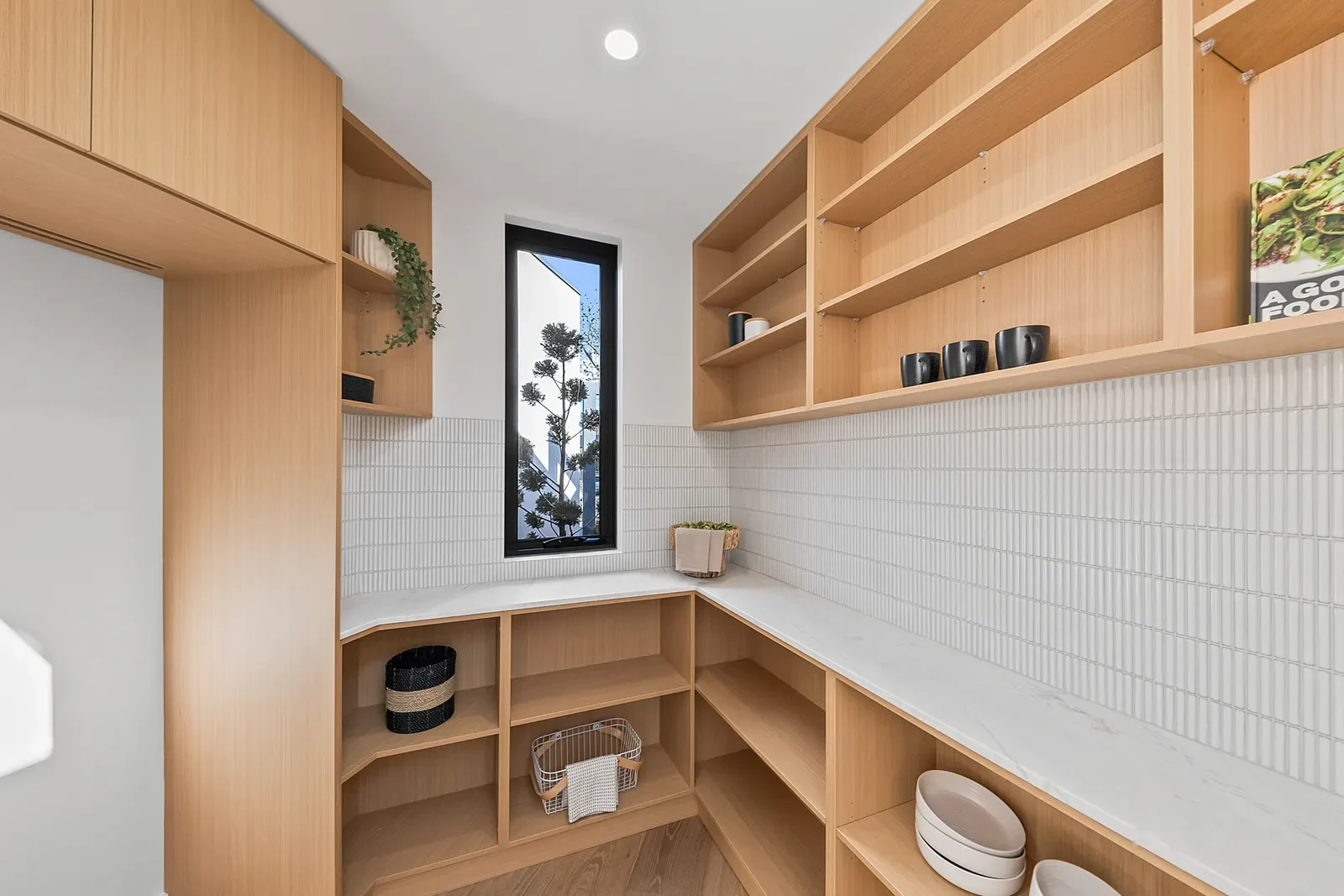 Butler's pantry with timber shelving and finger tile splashback