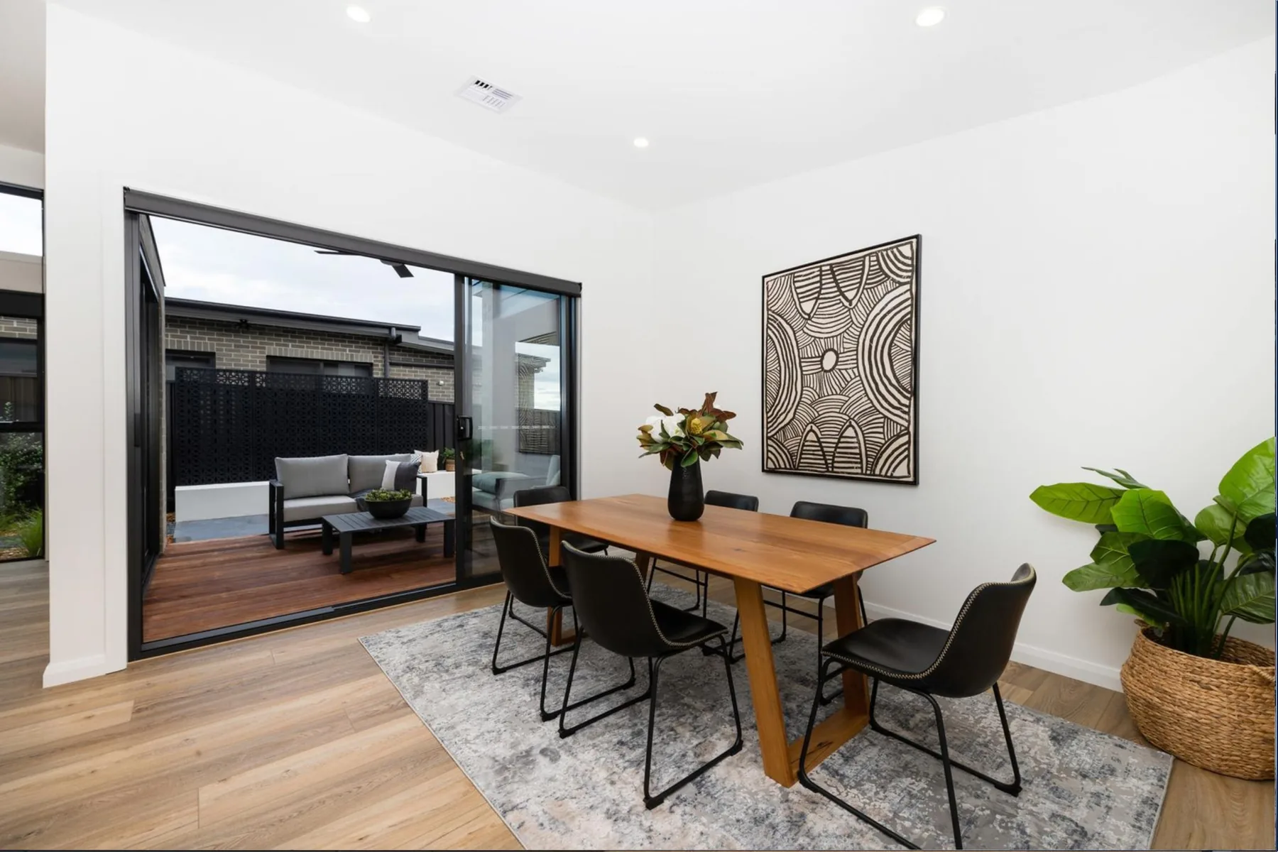 Dining area and alfresco, contemporary family home in Canberra